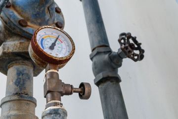 manometer pipes and valve in boiler room. Pressure gauge