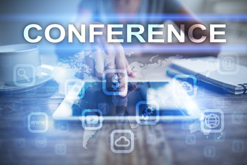 Woman using tablet pc, pressing on virtual screen and selecting conference.