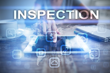 Woman using tablet pc, pressing on virtual screen and selecting inspection.