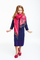 Charming little lady in sleeve midi dress and pink scarf.