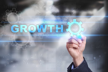 Businessman is drawing on virtual screen. growth   concept.
