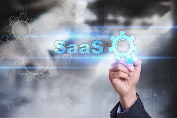 Businessman is drawing on virtual screen. saas concept.