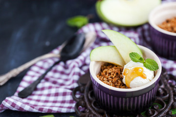 Apple crumble dessert with vanilla ice cream