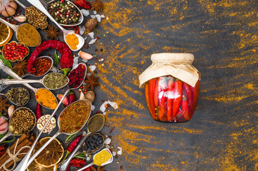 Various spices spoons on stone table. Top view .