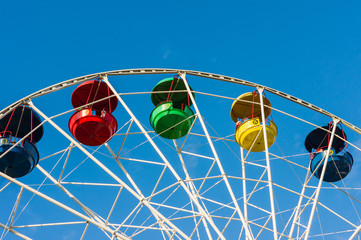 A colored ferris wheel in a children park