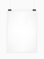 White vertical poster template hanging on clips, isolated on a white background. Poster realistic mokcup on a wall .