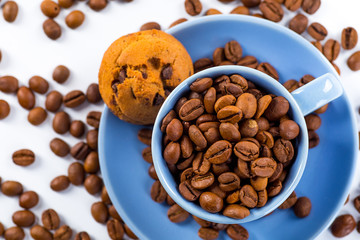 Coffee cup and beans on a white background.