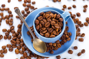 Coffee cup and beans on a white background.