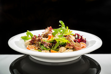 Healthy vegetarian salad and spicy soy cheese tofu with basil