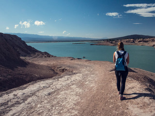 Dique de Ullum, San Juan Argentina, girl with backpack walking