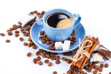 Cup of coffee and beans with delicious macaroon on a white background.