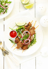 Beef shish kebab  on skewers in curry.