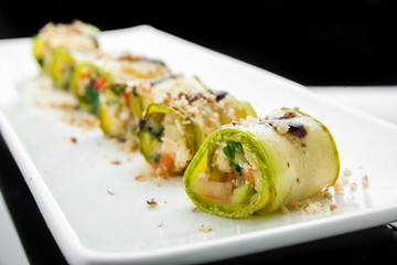 grilled zucchini with tomato, arugula and mozzarella cheese, drizzled with olive oil