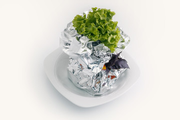 Meat with vegetables baked in aluminum foil