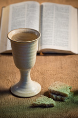 Fototapeta na wymiar Chalice Of Wine With Bread And Holy Bible