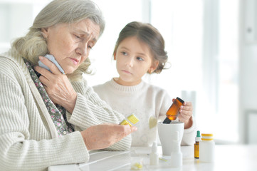 Granddaughter takes care of a sick grandmother