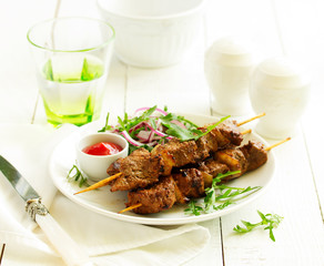 Beef shish kebab  on skewers in curry.
