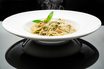 tasty pasta with salmon, dill on plate