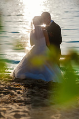 Wedding. A loving couple on the river bank