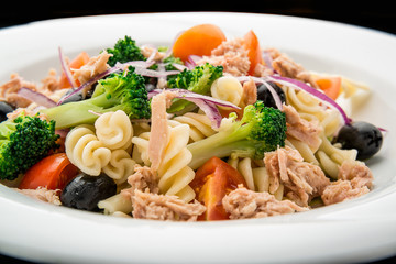 Pasta salad with tuna, olives and cherry tomatoes