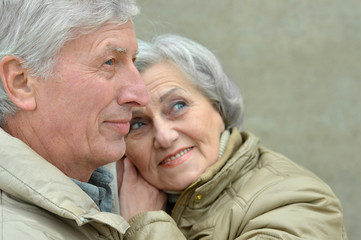 Happy elderly couple embracing