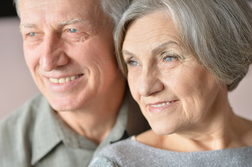Happy elderly couple embracing