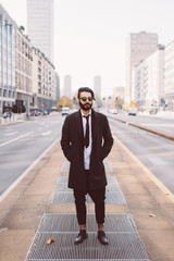 young bearded caucasian business man posing outdoor city - customer, business, startupper concept