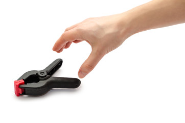 female hand holding clamp.