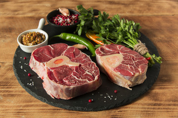 raw fresh meat on the bone cut  Osso Buco on board