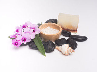 Fototapeta na wymiar Aromatherapy product Spa set ,candle ,soap,coconut orchid flower,shell, massage with white wood background . top view composition.
