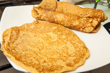 Quinoa crepes preparation :  Rolling up quinoa crepes