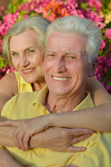 Happy elderly couple embracing