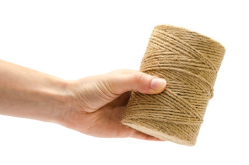 woman hand holding roll of twine.