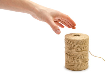 woman hand holding roll of twine.