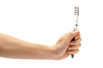 woman hand holding toothbrush.