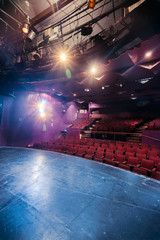 Theater stage and seats with dramatic lighting