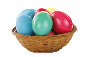 Fototapeta na wymiar colour eggs on basket isolated