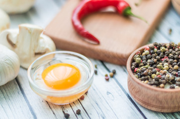 Still life with pasta ingredients on the wooden background