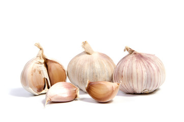 Fresh organic garlic and cutted garlic clove isolated on white background