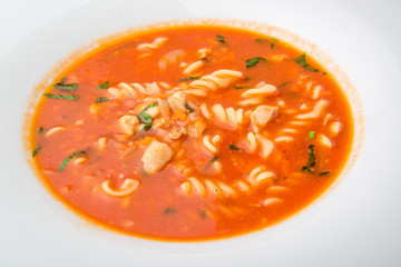 tomato soup with pasta on the plate