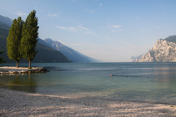 Lake Garda in Italy, surrounded by the Alps - obrazy, fototapety, plakaty