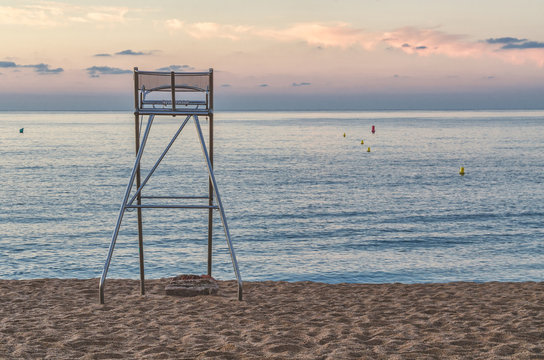 Beach chair for rescuers at sunset