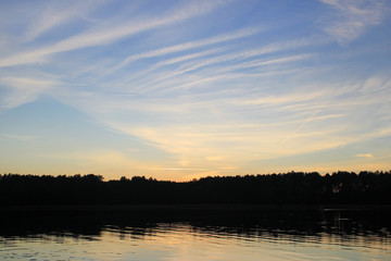 Fototapeta na wymiar Evening sky above the lake