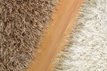 Brown and white hairy carpets divide in half and floating floor