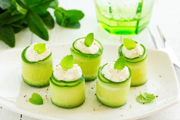 Gordijnen Rolls of cucumber with curd cheese and yogurt with mint. © ld1976