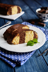 Traditional Meter Cake stuffed with vanilla cream and chocolate topping