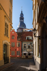 RIGA, LATVIA - 12 JUN 2016: Narrow street leading to the Dome church in Old Town