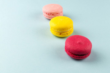 Colourful french macaroons on the grey background
