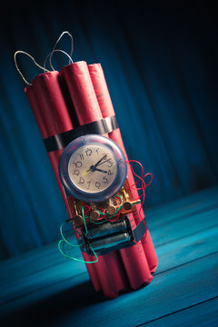 High contrast image of a timebomb on a wooden background
