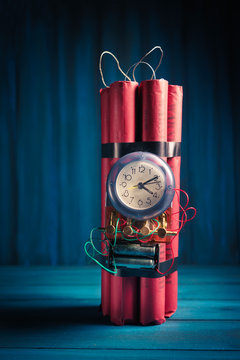 High contrast image of a timebomb on a wooden background